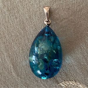 Blue Baltic Amber and sterling silver pendant